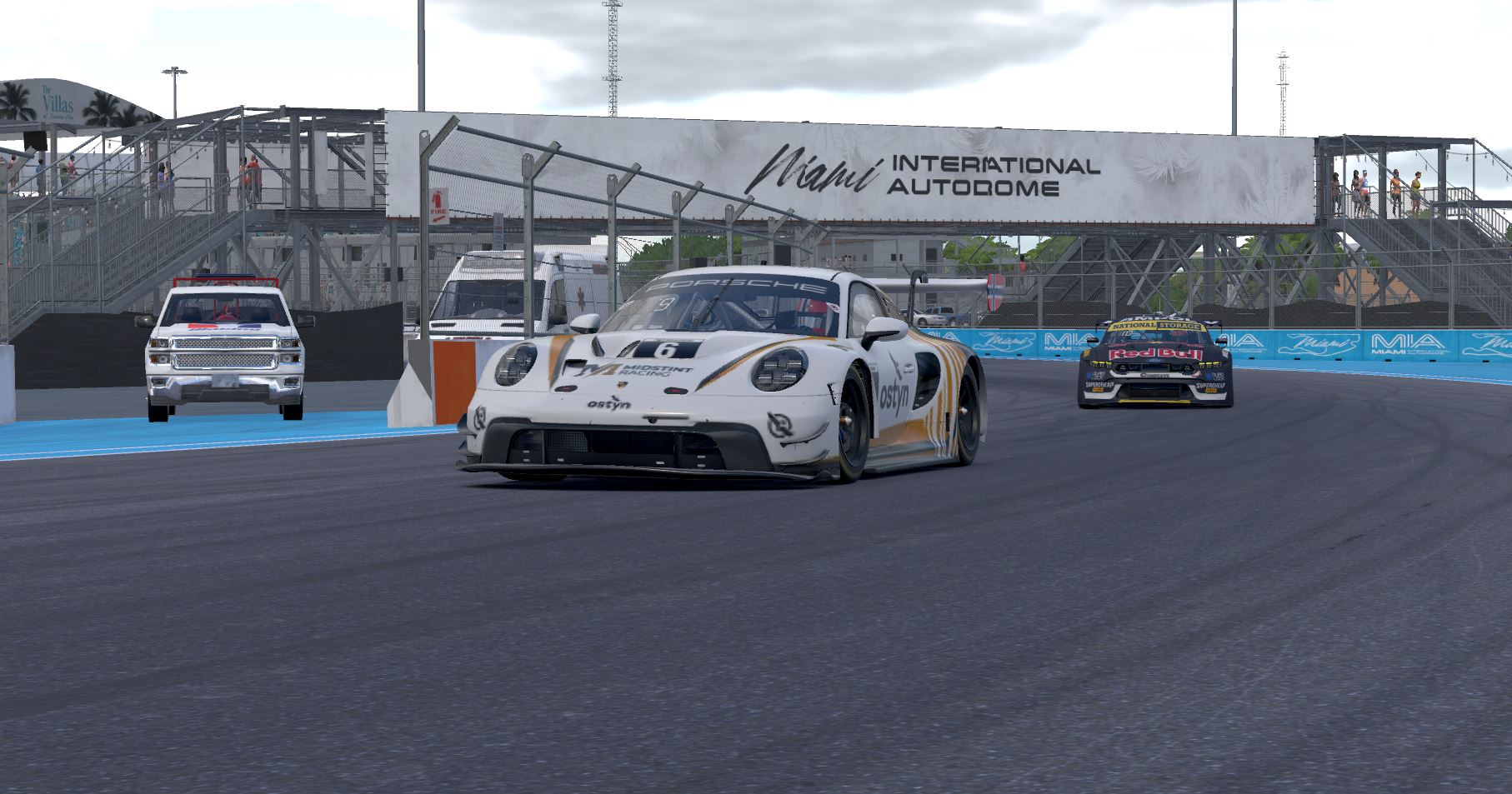 Midstint Racing Porsche 911 GT3 R in Miami daylight showing full livery with Ostyn branding