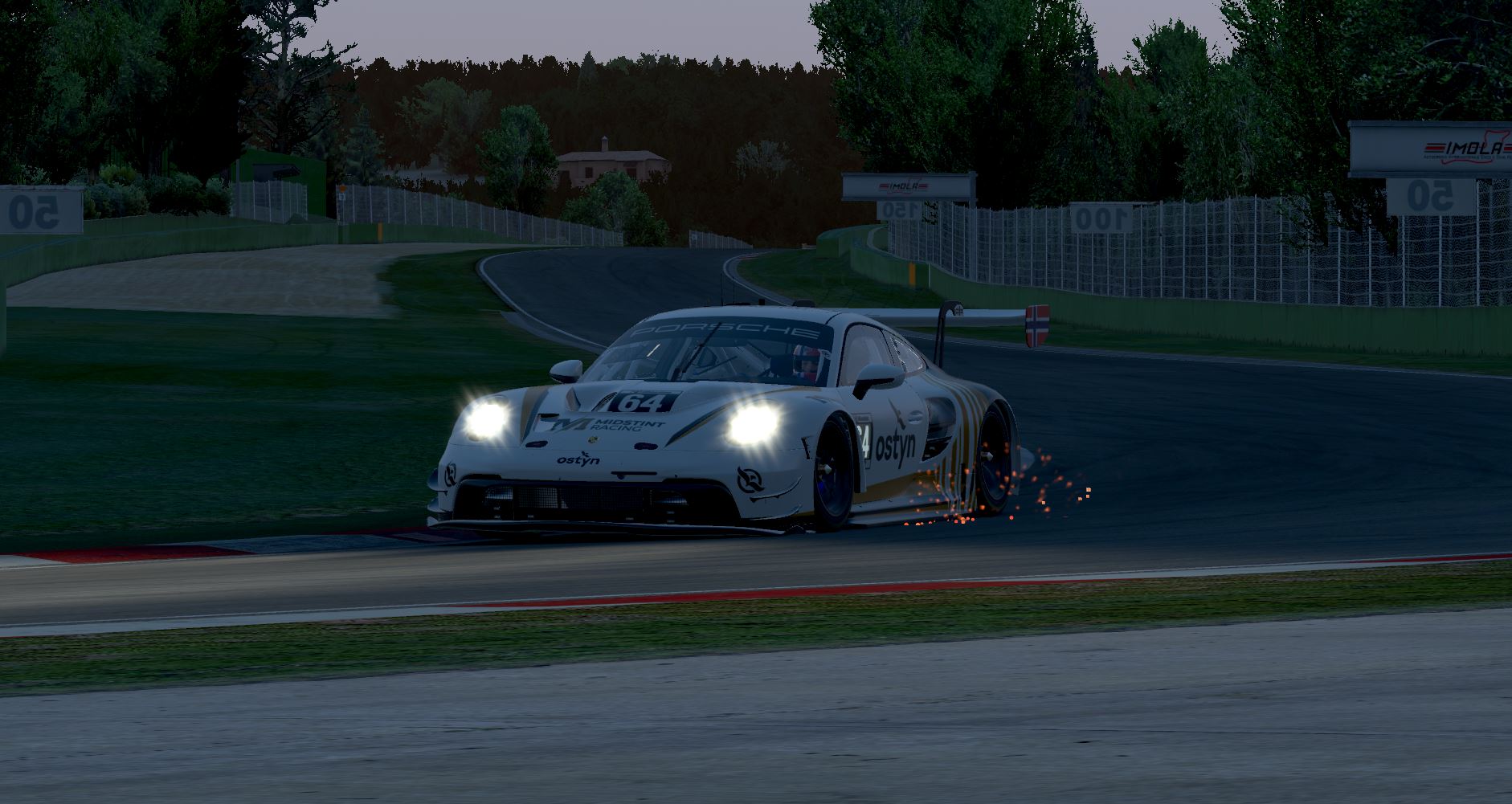 Matthias's Porsche 911 GT3 R at night at Imola with headlights blazing